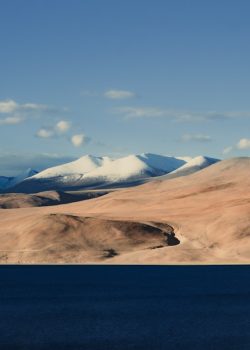 A large body of water surrounded by mountains