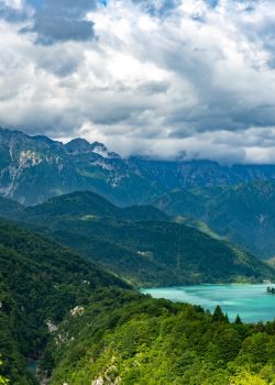 A scenic view of a lake surrounded by mountains