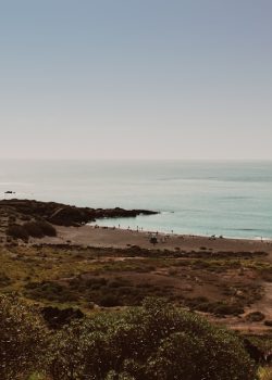 A view of a body of water from a hill