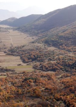 A view of a valley with a river running through it