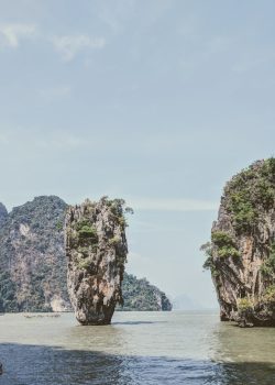 a body of water surrounded by mountains and trees
