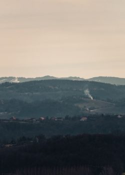 a view of a mountain range with a town in the distance