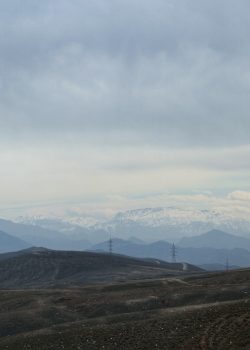 a view of a mountain range with mountains in the background