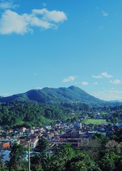 a view of a small town in the mountains