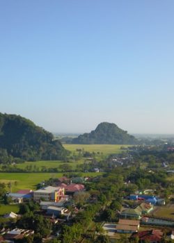 an aerial view of a village in the mountains